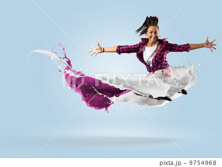 young female dancer jumping with splash of paint young female dancer jumping with splash of paint 9754968