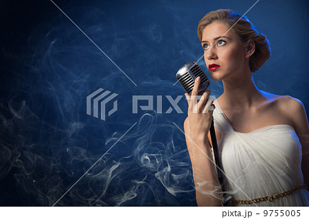 attractive female singer with microphone 9755005