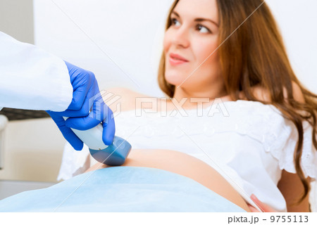 close-up of hands and abdominal ultrasound scanner close-up of hands and abdominal ultrasound scanner 9755113