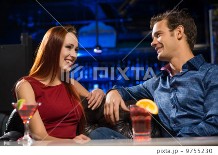 Young couple talking in a nightclub 9755230