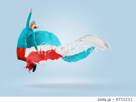 young female dancer jumping with splash of paint young female dancer jumping with splash of paint 9755231
