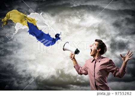 man yells into a megaphone man yells into a megaphone 9755262