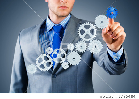 businessman touch the mechanism 9755484