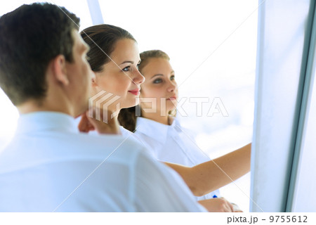 businessmen are meeting near the flipchart businessmen are meeting near the flipchart 9755612