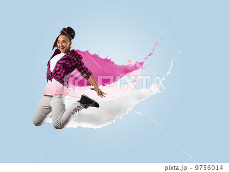 young female dancer jumping with splash of paint young female dancer jumping with splash of paint 9756014