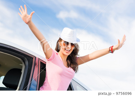 Young woman got out of car window 9756096