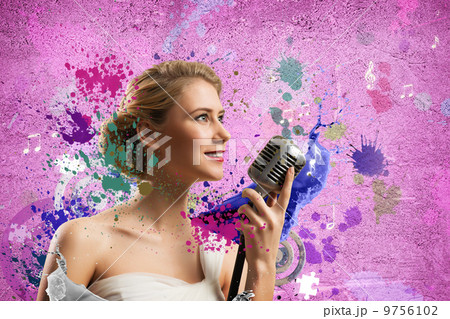 attractive female singer with microphone 9756102