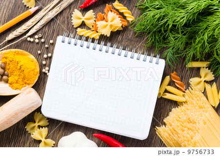 spices and vegetables around notebook 9756733