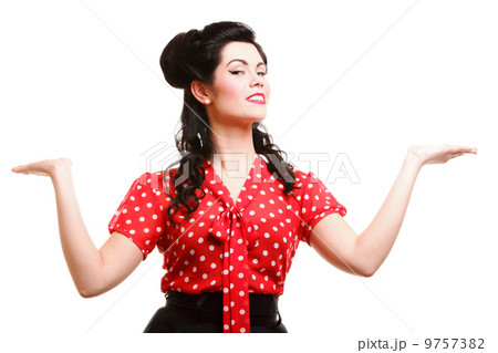 woman pin-up make-up hairstyle posing in studio 9757382