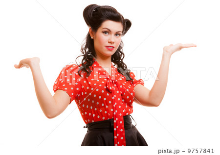 Retro pin-up girl young woman shrugging her sholders isolated 9757841