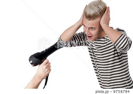 Portrait of man and hairdryer 9758794