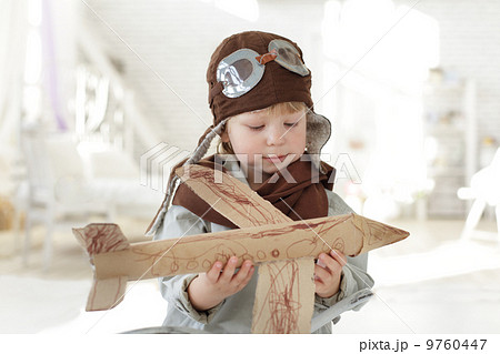 happy boy with airplane in hand 9760447