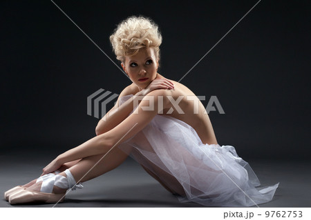 Shot of curly blonde ballerina posing in studio Shot of curly blonde ballerina posing in studio 9762753