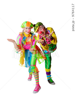Two cheerful clowns in the soap bubbles isolated on a white background 9764117