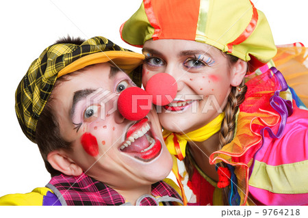 Two smiling clowns isolated over a white background 9764218