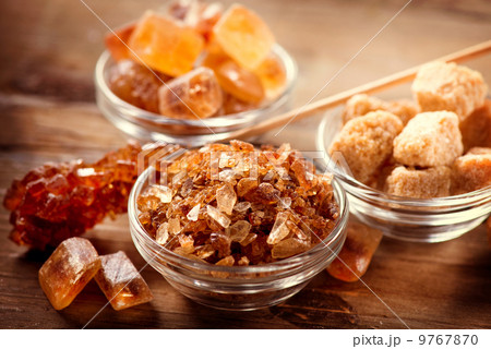Sugar. Brown Sugar on a Wooden Background 9767870