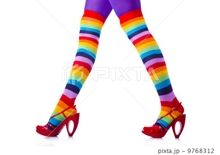 Woman legs in colourful stockings on white 9768312