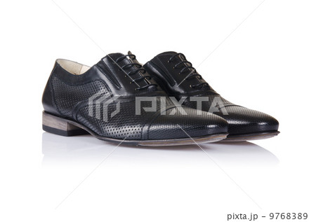 Fashion concept with male shoes on white Fashion concept with male shoes on white 9768389