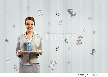 business woman holding a tablet with british pound business woman holding a tablet with british pound 9768650