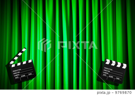 Movie clapper board against curtain 9769870