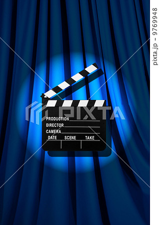 Movie clapper board against curtain Movie clapper board against curtain 9769948