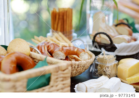 Fresh cheese and bread on a table Fresh cheese and bread on a table 9773145