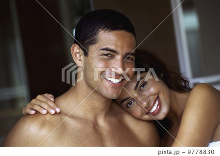 A couple, man and woman, embracing and laughing. A couple, man and woman, embracing and laughing. 9778830