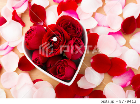 Rose and diamond ring inside the heart shape bowl 9779412