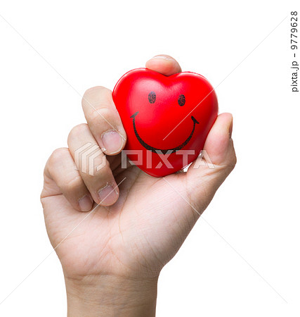 Hand squeezing a stress ball 9779628