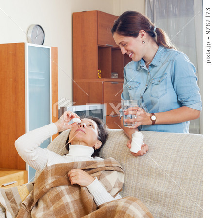 Mature woman dripping nasal drops 9782173