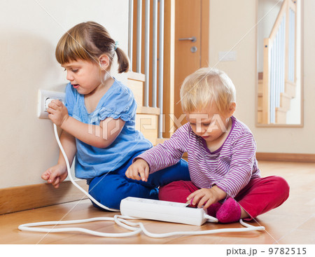 Two children playing with electricity Two children playing with electricity 9782515