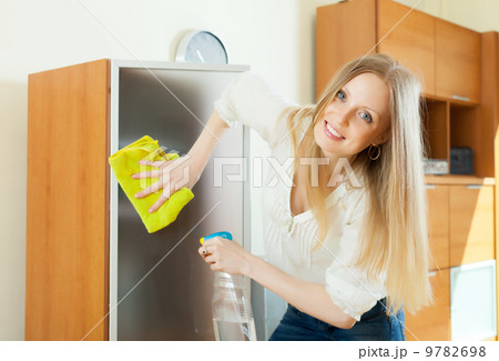 Blonde woman cleaning glass 9782698