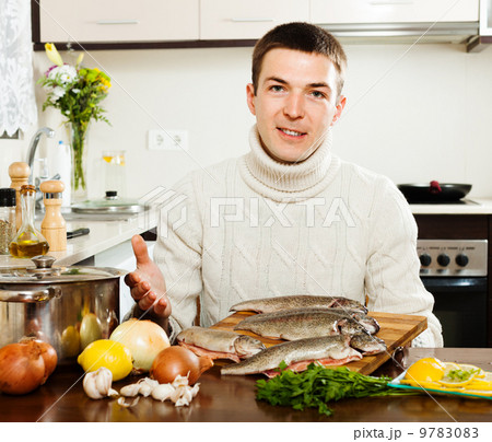Handsome man with trout fish 9783083