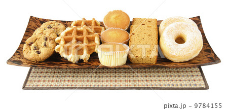 Cakes, cookies, donuts and waffels on the plate Cakes, cookies, donuts and waffels on the plate 9784155