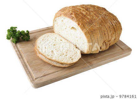 Cutted white bread on the wooden board with parsley Cutted white bread on the wooden board with parsley 9784161