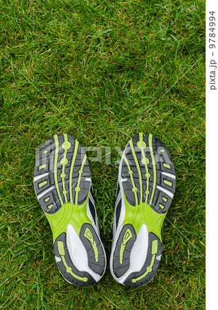Sneakers soles on grass 9784994