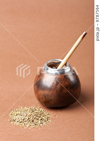 calabash and bombilla with yerba mate isolated on brown backgrou 9787564