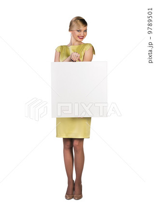 Beautiful young business woman with blank board 9789501