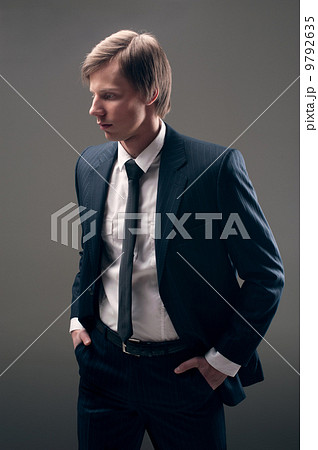 guy in black expensive suit 9792635