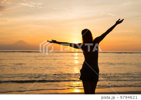 Woman watching sunset Woman watching sunset 9794621