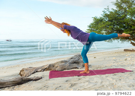 Young woman practicing yoga 9794622