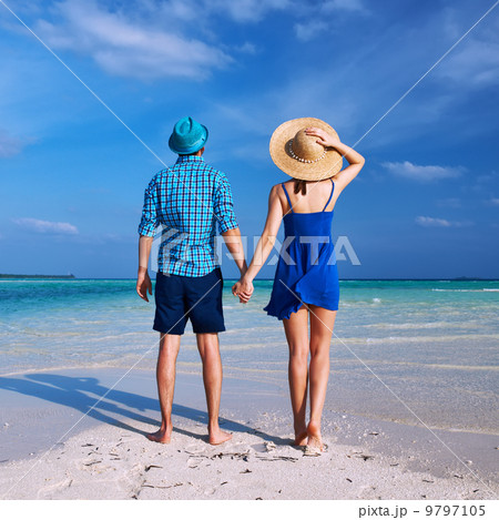 Couple in blue on a beach at Maldives Couple in blue on a beach at Maldives 9797105