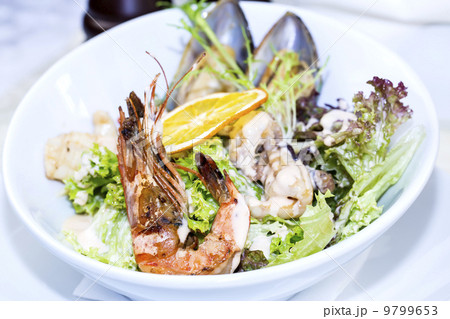 seafood salad on a white background in the restaurant 9799653