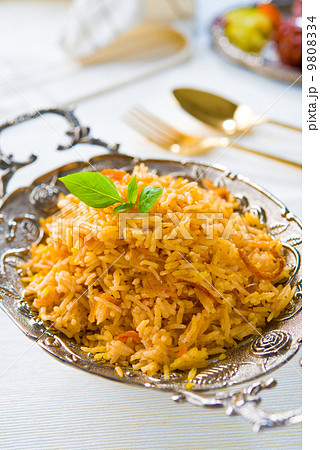 Biryani rice or briyani rice, curry chicken and salad, tradition 9808334