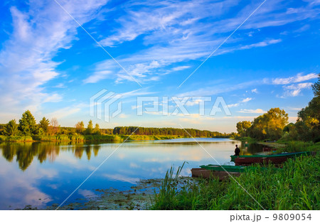 Clouds Reflection On Lake River 9809054