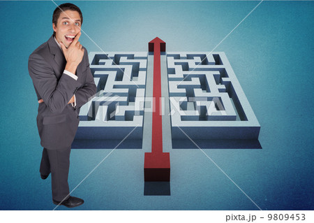 Composite image of thinking businessman touching his chin 9809453