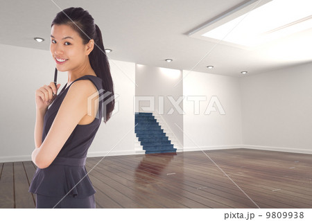 Composite image of thoughtful businesswoman 9809938