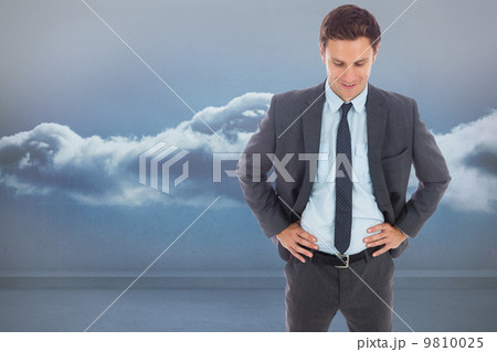 Composite image of cheerful businessman standing with hands on h Composite image of cheerful businessman standing with hands on h 9810025