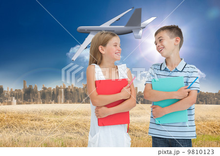 Composite image of smiling brother and sister holding their exer 9810123