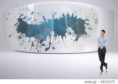 Composite image of serious asian businessman 9810375